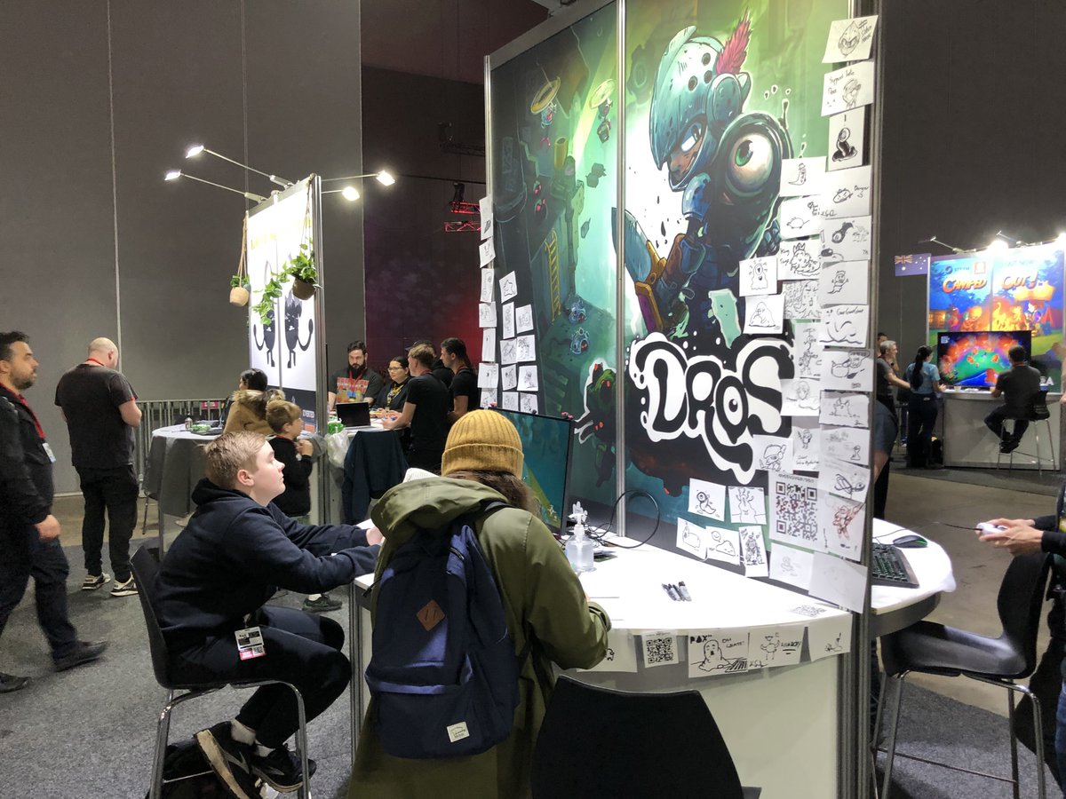 DROS_game's tweet photo. It's our final day @PAXAus 

Our draw a Dros wall is growing with some spectacular art! Come and say hi to the team and give Dros a play.

#IndieGameDev #indiegame #gamedev https://t.co/Q89Aesa8uq