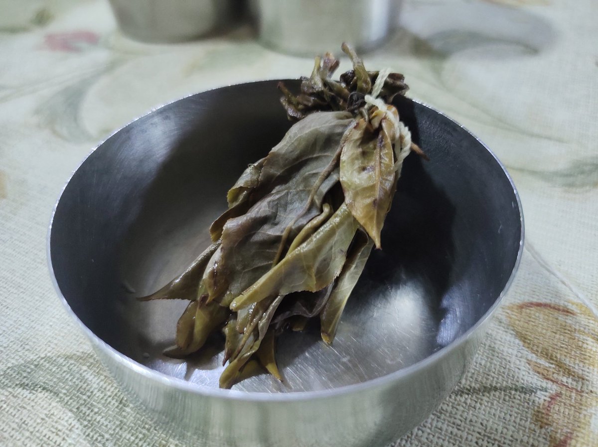 Cocoatrait's tweet photo. This exquisite rare Assam whole leaf green tea rests in peace having achieved what it was born for! Three accurate brews and 6 flavourful cups later, they travelled the journey to me completely plastic free in a dice shaped cluster and packed in plastic free paper envelopes. https://t.co/XHx8Fl3E75