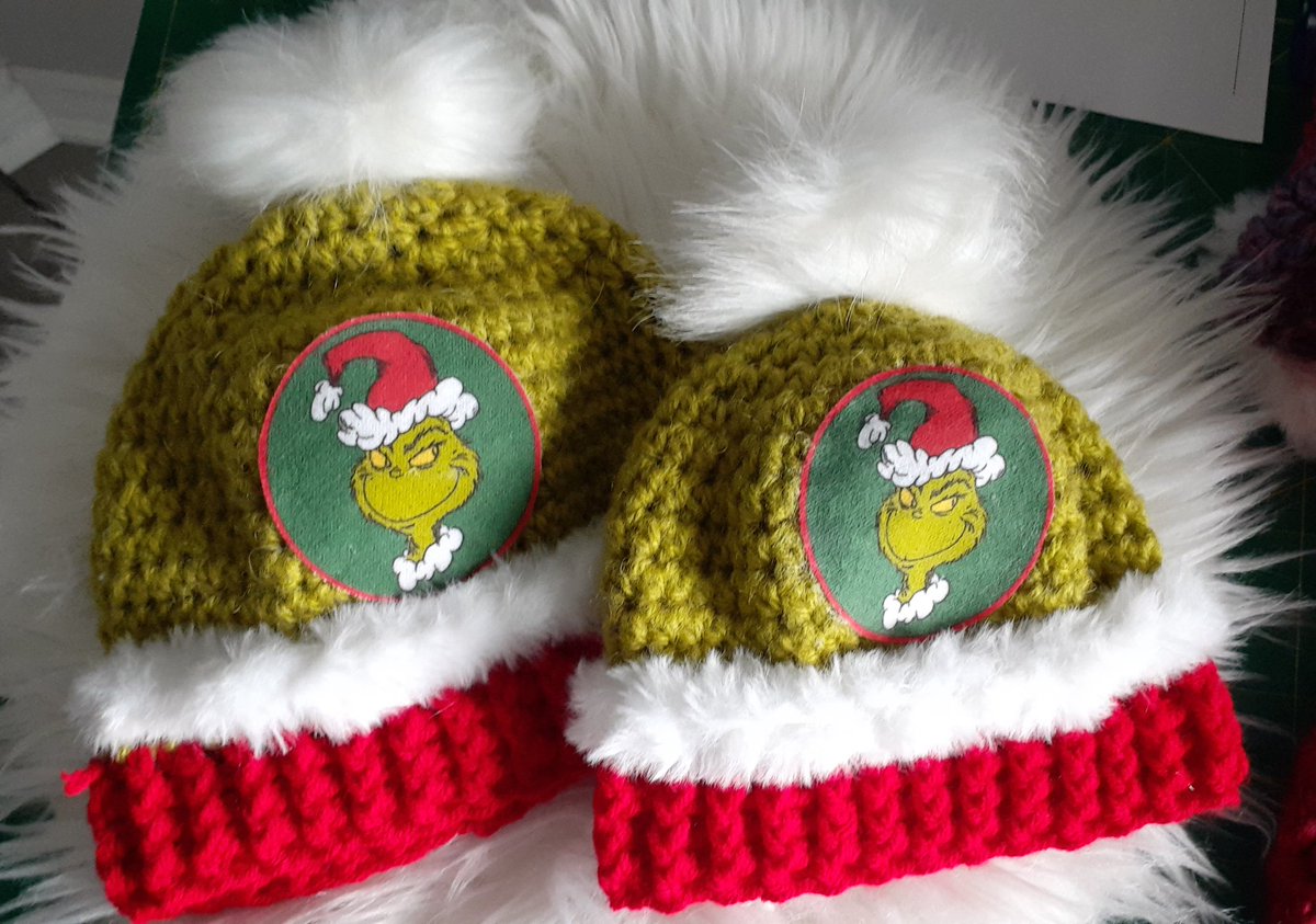 Small and smaller crochet grinch hats. Made by me. Removable pom pom