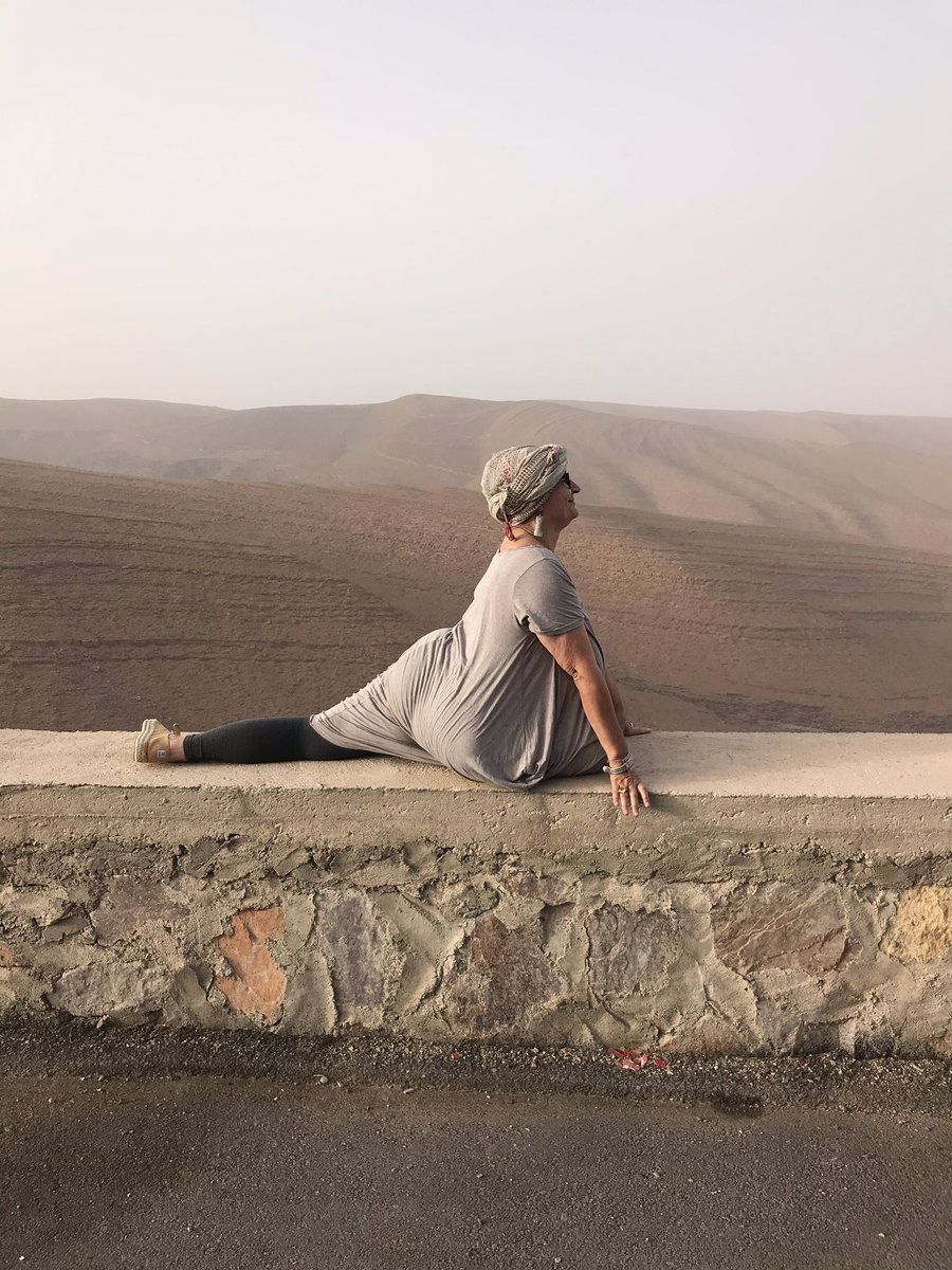 exmoorjane's tweet photo. Nice spot for a quick King Pigeon!  Gertrud of @YobabaLounge doing her #yoga thing on the road.  With added view. #Morocco https://t.co/UqnU9TUdNJ
