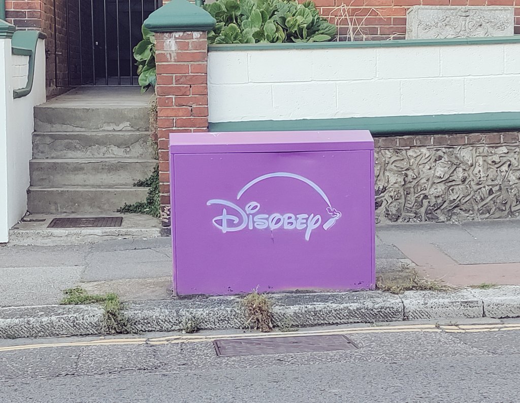 abs014's tweet image. Spotted the sign while waiting at a bus stop. This cheered me right up! #Disobey #Disney #Brighton