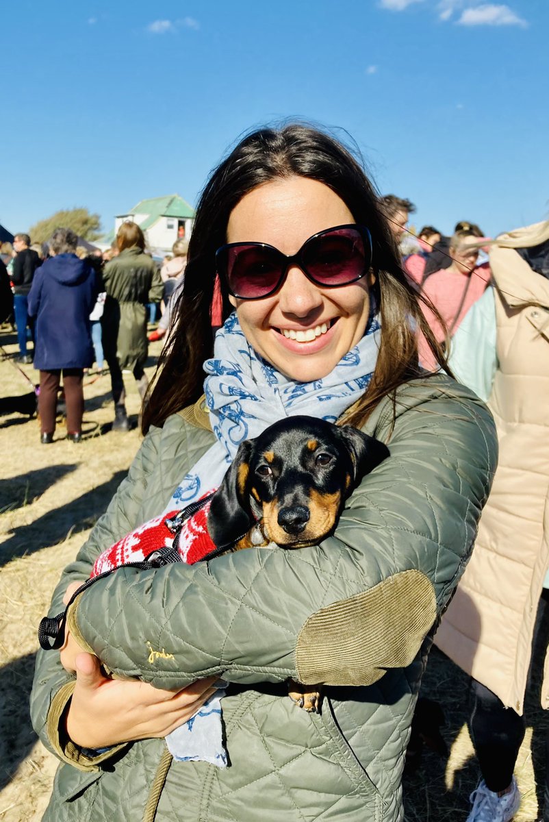tanyamercer's tweet photo. I’ve had worse days… Filming at the world record attempt for the biggest sausage dog walk! And to top it all off, Southwold looked beautiful in the sunshine. This is me with little Gus - just 13 weeks old. #sausagedog #Dachshunds #southwold #reporting https://t.co/fklyoqC2an