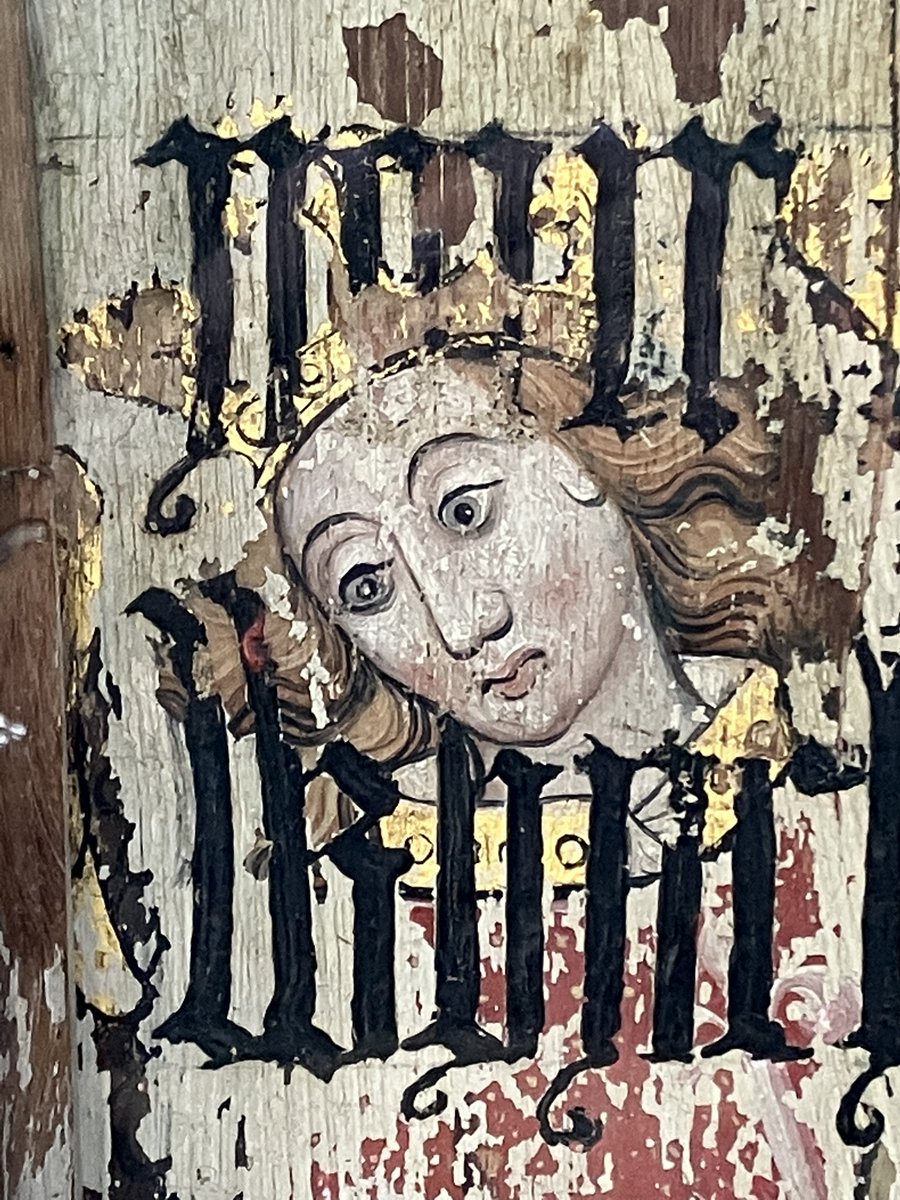 The image of St Michael on the rood screen at Binham Priory (c1500) was overpainted with words from Cranmer's bible of 1539.