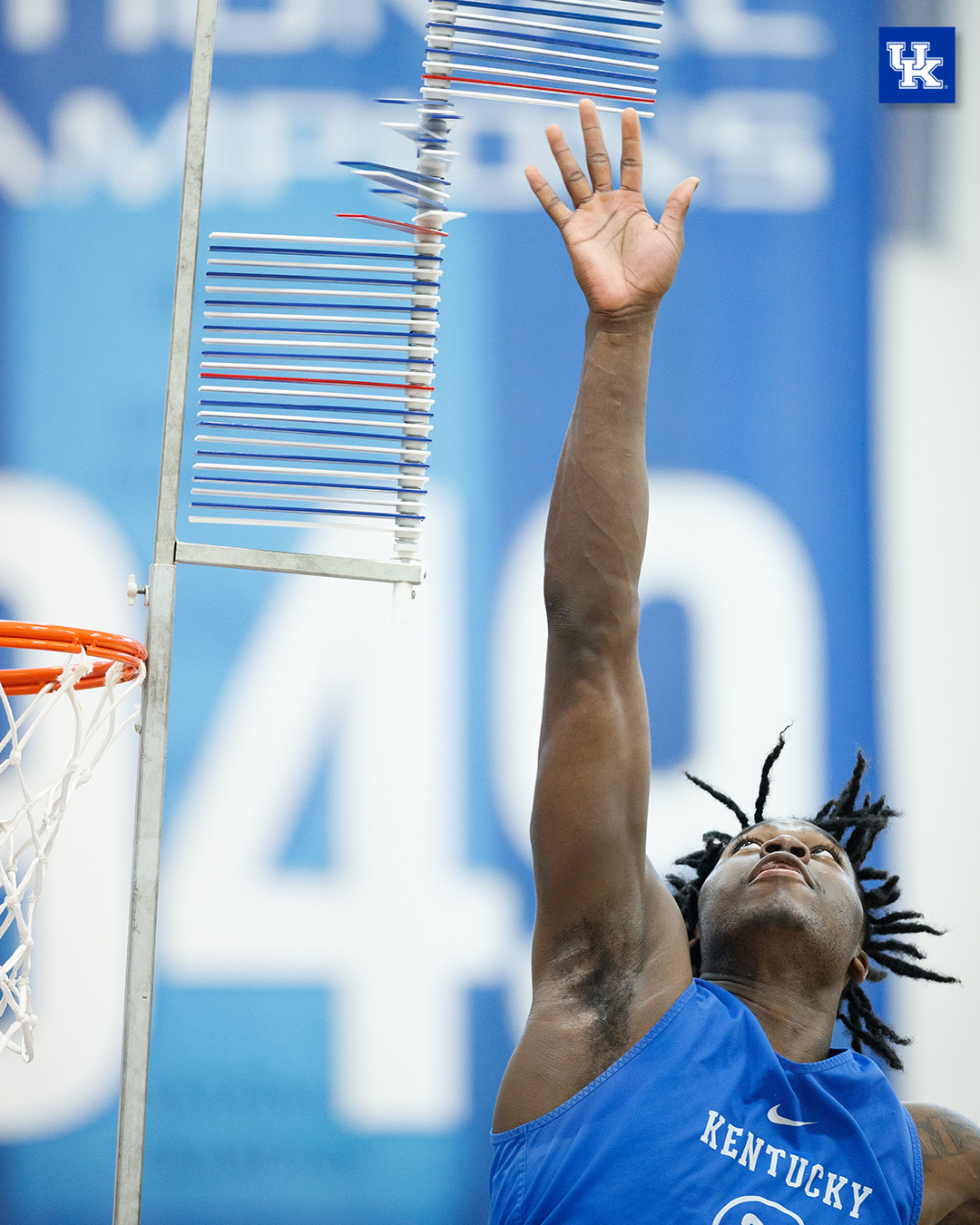 Chris Livingston reaches during his vertical jump.