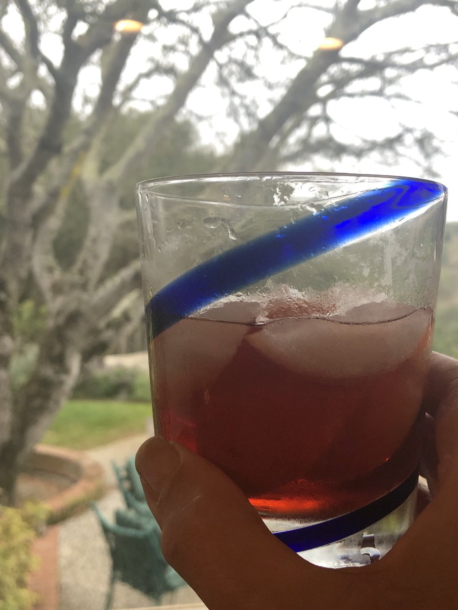 Negroni on a cold overcast Sunday night - in the kitchen cooking dinner . Salud