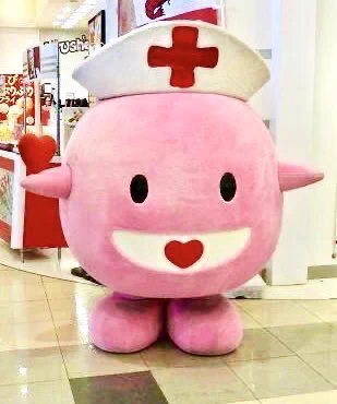 Kokoron-chan, a spherical pink nurse with one heart in her mouth and another balanced on her hand, is the blood donation mascot for Iwate, Japan. 