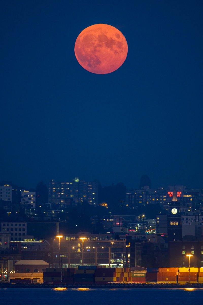 Tonight's #FullMoon rising over Seattle and the King Street Station