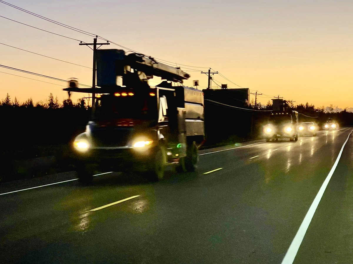 Our #Fiona power repair crews off to work thru Pooles Corner on reconnecting 4500 on #PEI still without electricity. No Thanksgiving holiday for these crews who have come from across Canada. We are grateful. Somewhere there will be a hot turkey dinner for them tonight. <a href="/CBCPEI/">CBC P.E.I.</a>