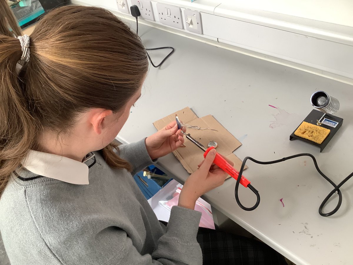 Oide_SarahMc's tweet photo. TYs nearly halfway through their Stained Glass module! Students are making a hanging decoration by cutting coloured glass, wrapping in copper tape and soldering together. #transitionyear #ddletb @Kingswoodcc16 https://t.co/LcK15VwLJp