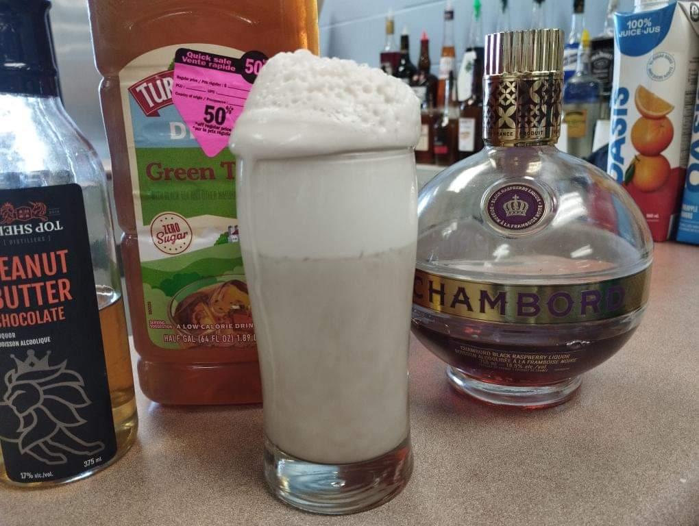 DowntheHatchAC's tweet photo. Come one, come all! Here is the first look at Peanut Butter Ice Tea from @DowntheHatchAC and @BestBarMix. We used egg whites in this drink to create an amazing head of foam on top of green tea, raspberry, and peanut butter liqueur. More new cocktails at #ACMixHour https://t.co/n5BmF4ei9O