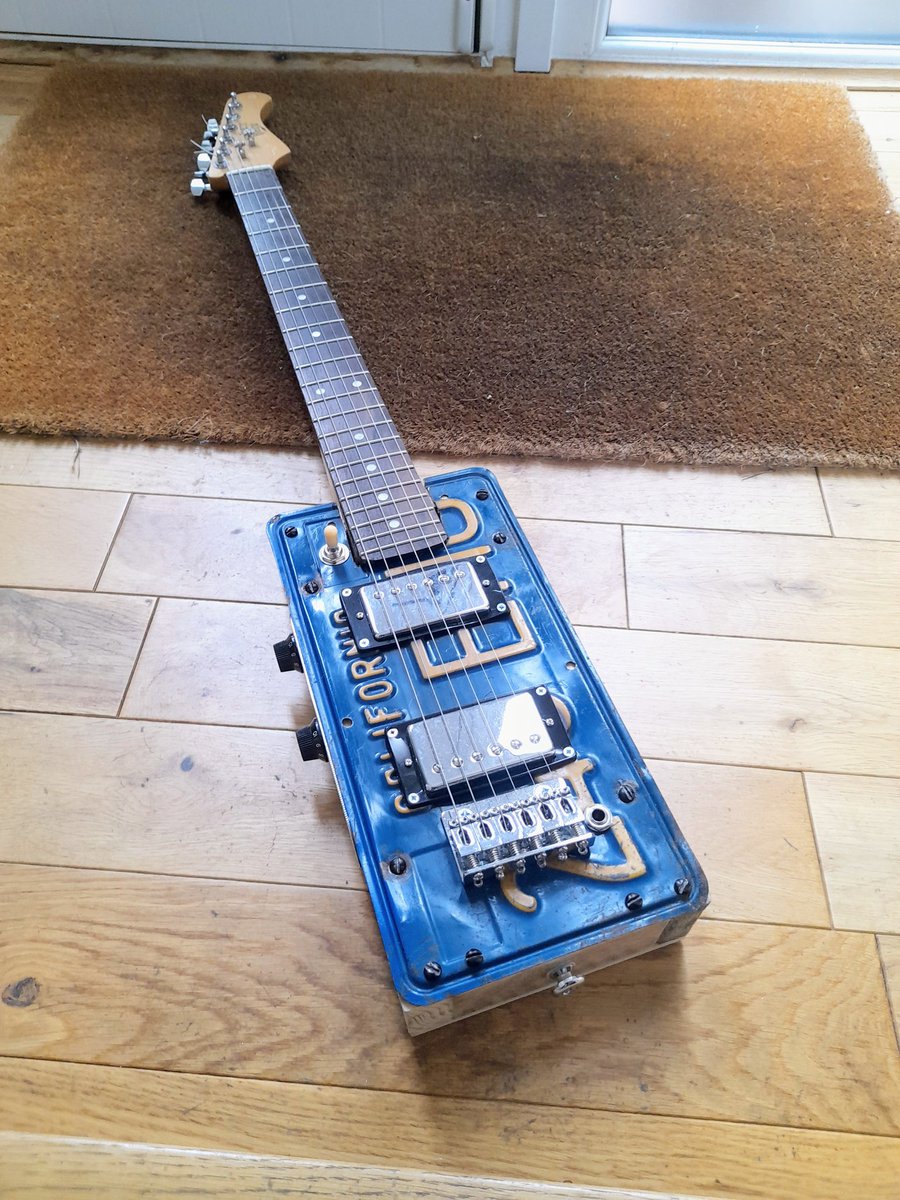 johnsaunders68's tweet photo. Some lockdown projects.  #johnsguitarprojects #licenseplateguitar #oilcanguitar #homemadeguitar https://t.co/r3DnuXg7BD