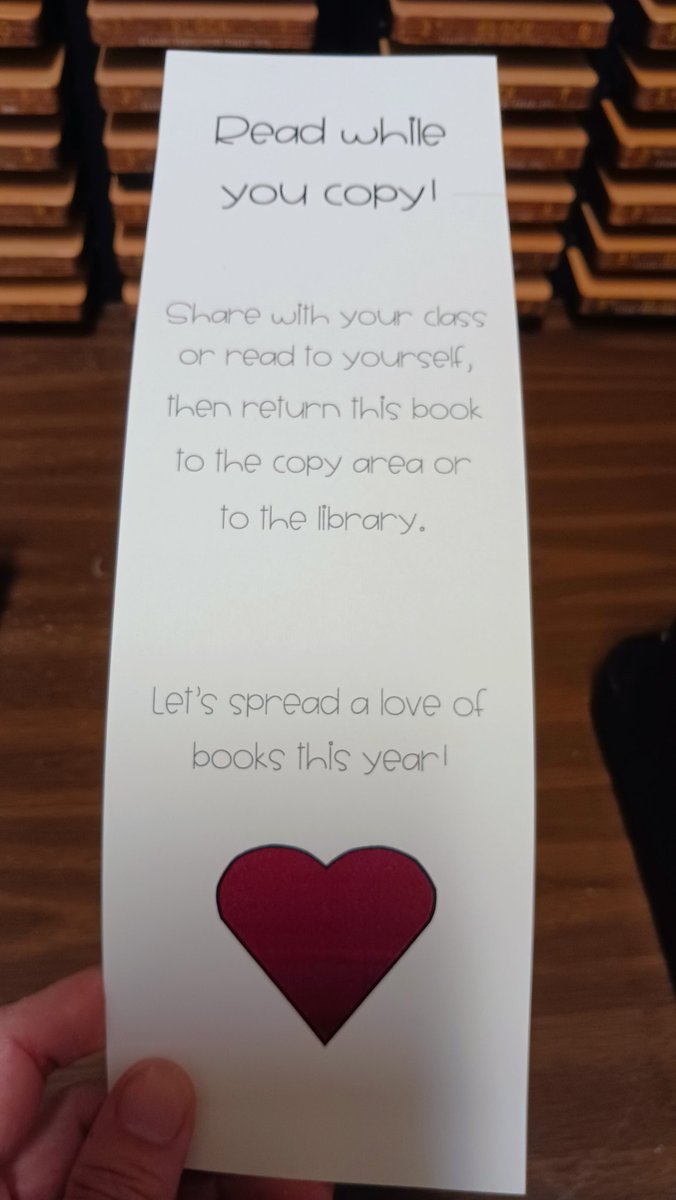 musuzq's tweet photo. "Read while you copy!" has been a big hit this year!  I made bookmarks for the different copy areas in our school, and then I rotate the books each week.  This allows teachers to see different types of books that are in our library! #libraryideas #readwhileyoucopy https://t.co/oHb9aBs6bg