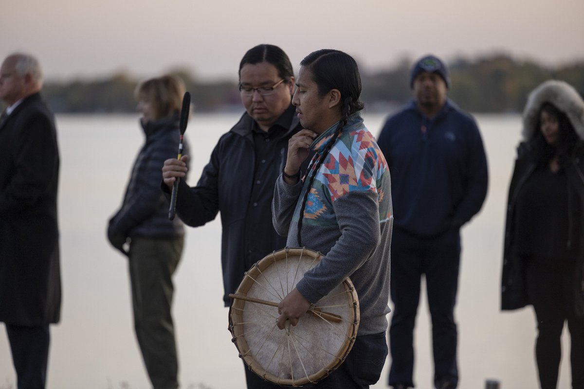 SahanJournal's tweet photo. @Jaida_GreyEagle Community members gathered in a circle to offer prayers and songs led by Wakinyan, Thorne and Lemoine LaPointe (Sicangu Lakota) as the sun rose above the lake in Minneapolis. https://t.co/Auimp3VnNf