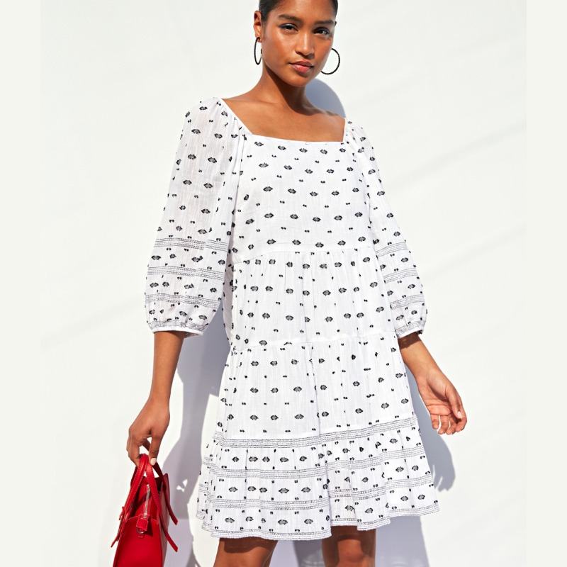 WOOLWORTHS_SA's tweet photo. Stand out this summer in a printed dress, paired with a brightly coloured bag and not-so-subtle hoops for a chic-casual look that’ll turn heads.