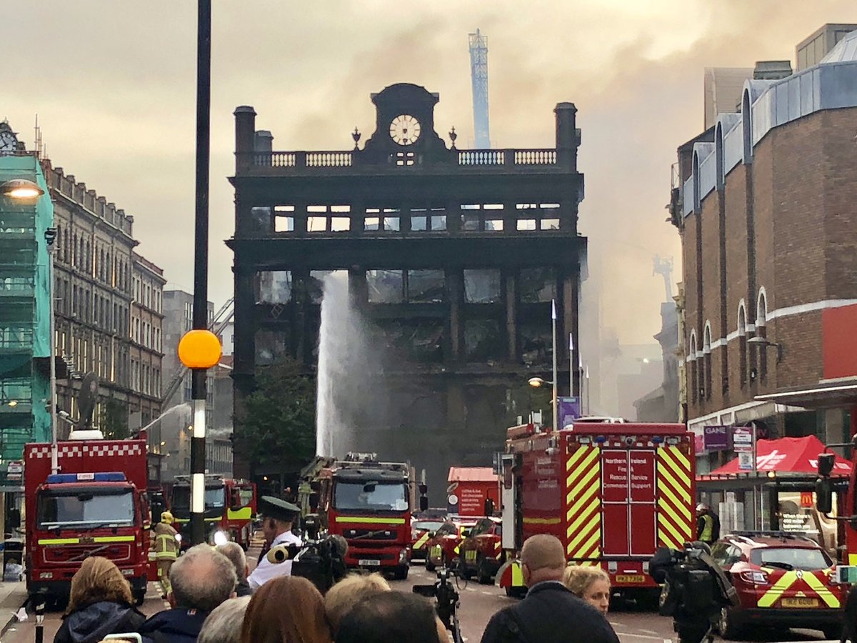 chrisandrews89's tweet photo. Two photos, four years apart. On that day I doubt many believed this iconic Belfast building would still be standing never mind looking like this. https://t.co/8KsZXYl2Sm
