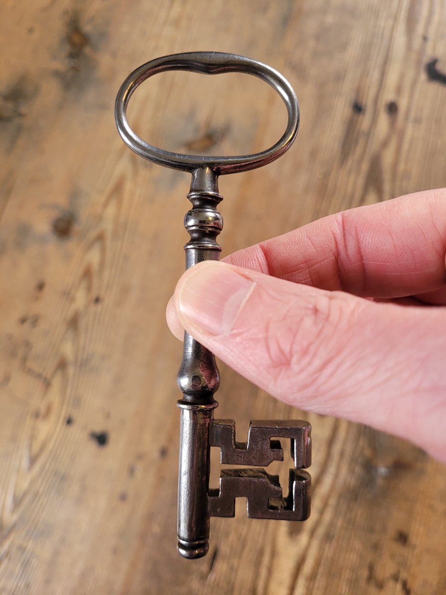 Snap! On the left, an illustrated newspaper ad from 1742 advertising the wares of a Dublin locksmith. On the right, a key still in use in Marsh's today in our reader cages built in 1767...