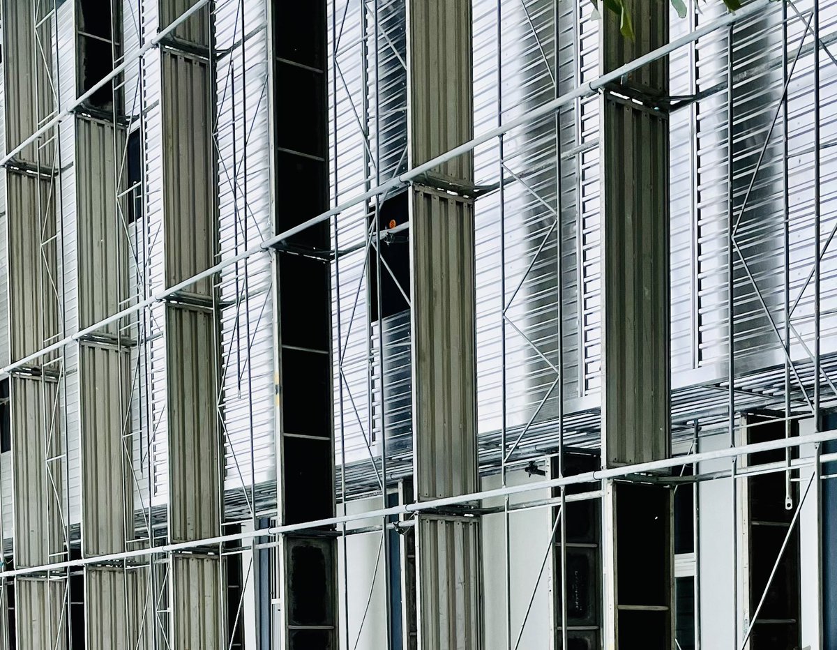 Petrit's tweet photo. Massive metal aluminum enveloping of the iconic Ulpiana towers. These are buildings retrofitted for energy efficiency by our foundation @MFKosovo, financed by @MCCgov, @KPrishtines &amp; residents. 
❄️Ready for winter. 
⚡️Lower energy cost. 
🛋 Higher comfort. 
🌳 Greener community. https://t.co/QwPL25rsO1