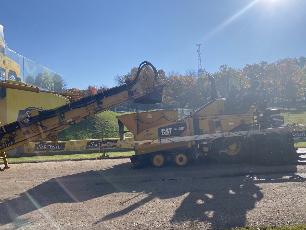 Beautiful fall a.m. for #repaving at Elkhart Lake’s iconic @roadamerica. Thank you for showing us around, #RoadAmerica & for an amazing setting as these machines, companies & people work hard to repave the track. @Walbecgroup #elkhartlake #catyellow @AsphaltContrctr @PavementMag