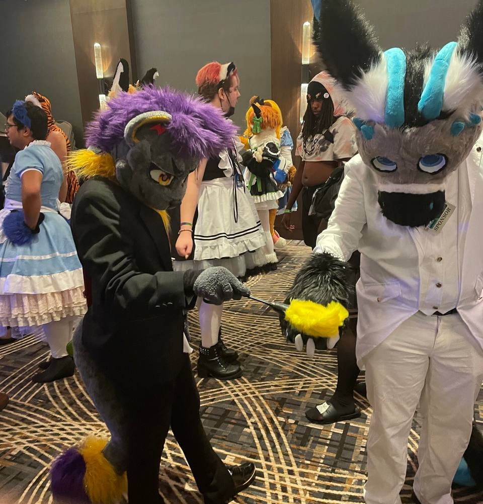Lucas33130669's tweet photo. Everest getting dusted off by booms at the maid/butler raid at #ACFI2022 #furry #furryconnection https://t.co/w1Clhq3Kzk