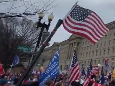 Nightvi17337331's tweet photo. @JusticeCat0106 P1 #SeditionFlags I don't know what that confederate looking flag w/ 1 red white & blue stripe. Gadsden yellow next to it, held by #SeditionSignals ? on top of a concrete marker at corner of 15th & const. @ 1:15ish.
P2 #SeditionWeapons Shower curtain rod with a small USA flag. https://t.co/Hu3kikJ17q