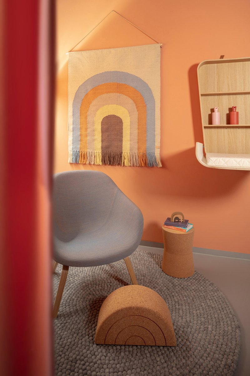 Private space allowing (breast) feeding and a little retreat time with your child 🧡 - equipped with kitchenette.

Baby change table by Charlie Crane Paris, chair by HAY design using Kvadrat textiles, drapes by Unique Factory Berlin