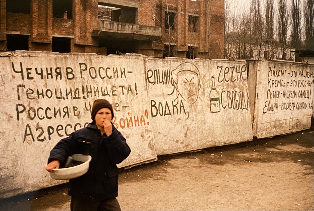 markomihkelson's tweet photo. I made this photo as a war correspondent in Grozny, Chechnya in February 1996. It reads - "Chechnya in Russia - genocide, poverty! Russia in Chechnya - aggression, war!" and "Reichstag - nazism! Kremlin- Russism!" This was 26 years ago. What has changed? https://t.co/aFsZaLJVLO