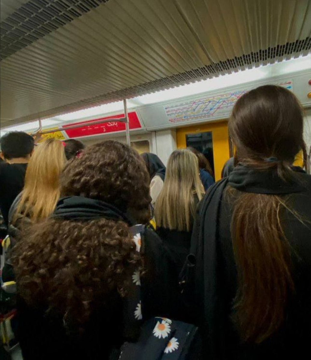 GEsfandiari's tweet photo. Tehran metro: 

Women are defying the mandatory hijab rule. 

#MahsaAmini  #مهسا_امینی https://t.co/h1rhd67oPy