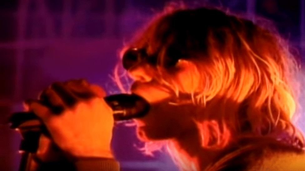Same energy as that one Nirvana performance on MTV where they were told they didn't actually want the band playing, just to pretend they were playing and so Kurt Cobain just deepthroated the microphone, while the rest of the band did the worst air guitar possible.