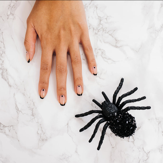 A mani 💀to-die-for! Halloween week is upon us and we'll help complete your costume with perfectly polished nails!⁣
⁣
👻Book your spooky service at bellacures.com! instagr.am/p/CkGEAwMLAC3/