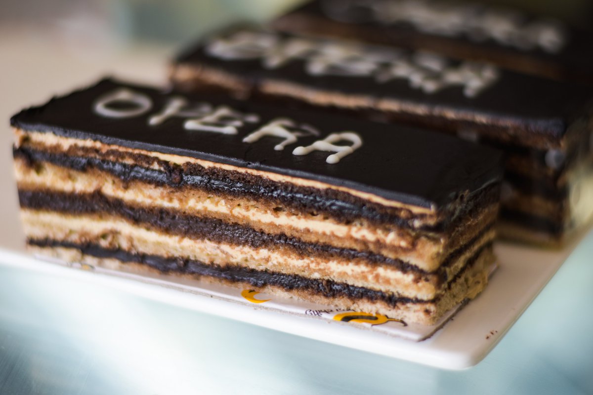 TheChillyYellow's tweet photo. Opera cake is a French cake. It is made with layers of almond sponge cake soaked in coffee syrup, layered with ganache and coffee French buttercream, and covered in a chocolate glaze. Enjoy the creamy chocolate and coffee flavors with @the_yellowchilly_cake_pizza
.
.
#operacake https://t.co/X8IGn3OA1r