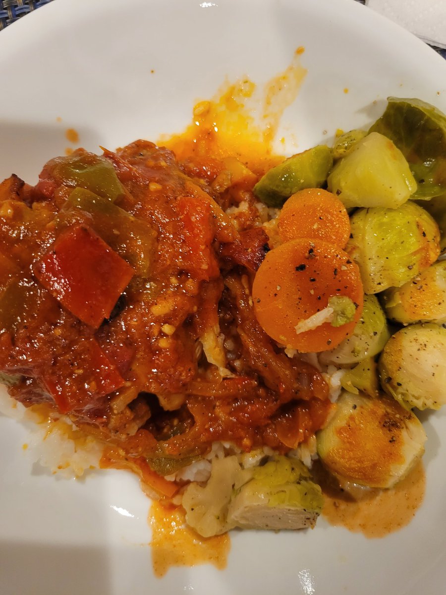 Last night's dinner! Chicken, tomatoes, red, green and yellow bell peppers over rice and brussel sprouts and carrots. #foodie