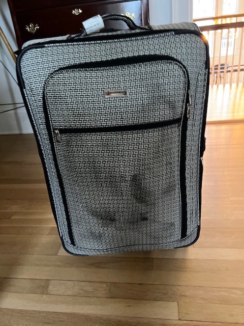 velozal's tweet photo. When your brand new suitcase comes off of the baggage claim carousel looking like this @AmericanAir https://t.co/K9wuOEAyDB