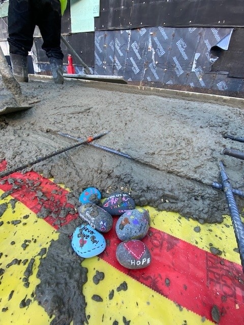 Last week, our #Memphis team began laying the foundation for the CVICU/NICU/PACU expansion at @LeBonheurChild. Rocks painted by patients – many including messages of love and hope – were carefully placed throughout the concrete slab. ❤️