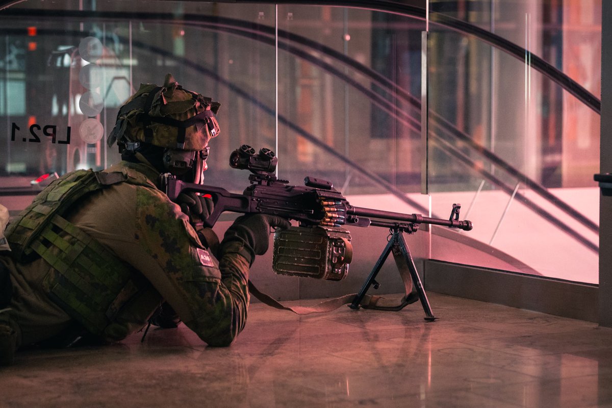 Finnish Army 'KaartJr' - Readiness unit conscript with a PKM, during an exercise at the Redi shopping centre in Helsinki (24 Sep, 2021)