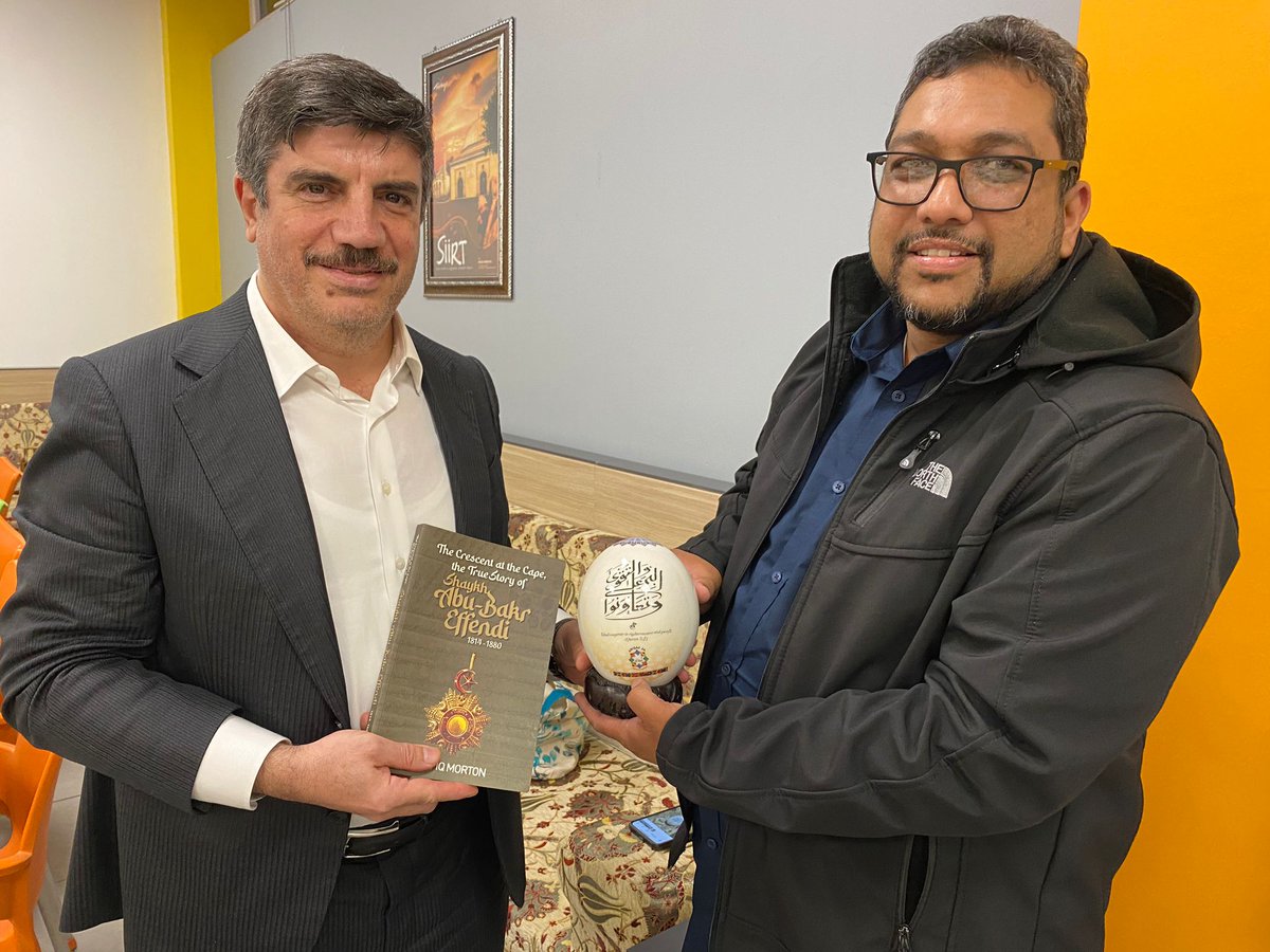 Awqaf SA Deputy CEO, Mickaeel Collier Gifted, on behalf of Awqaf SA, to Prof Dr. Yasin Aktay, a deputy chairman of the AK Party, a copy of the "The Crescent at the Cape, the real story of Shaykh Abubakr Effendi and an Ostrich Egg with a quranic verse.