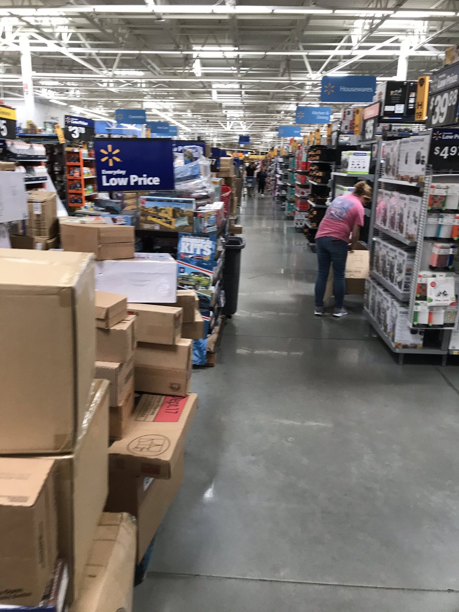 WilliamBraddock's tweet photo. Are these aisles handicap accessible?  Is this a safe shopping environment with stacked boxes everywhere, employees cutting open boxes, and pallet jacks in the aisles? https://t.co/D1mr5JFpNS