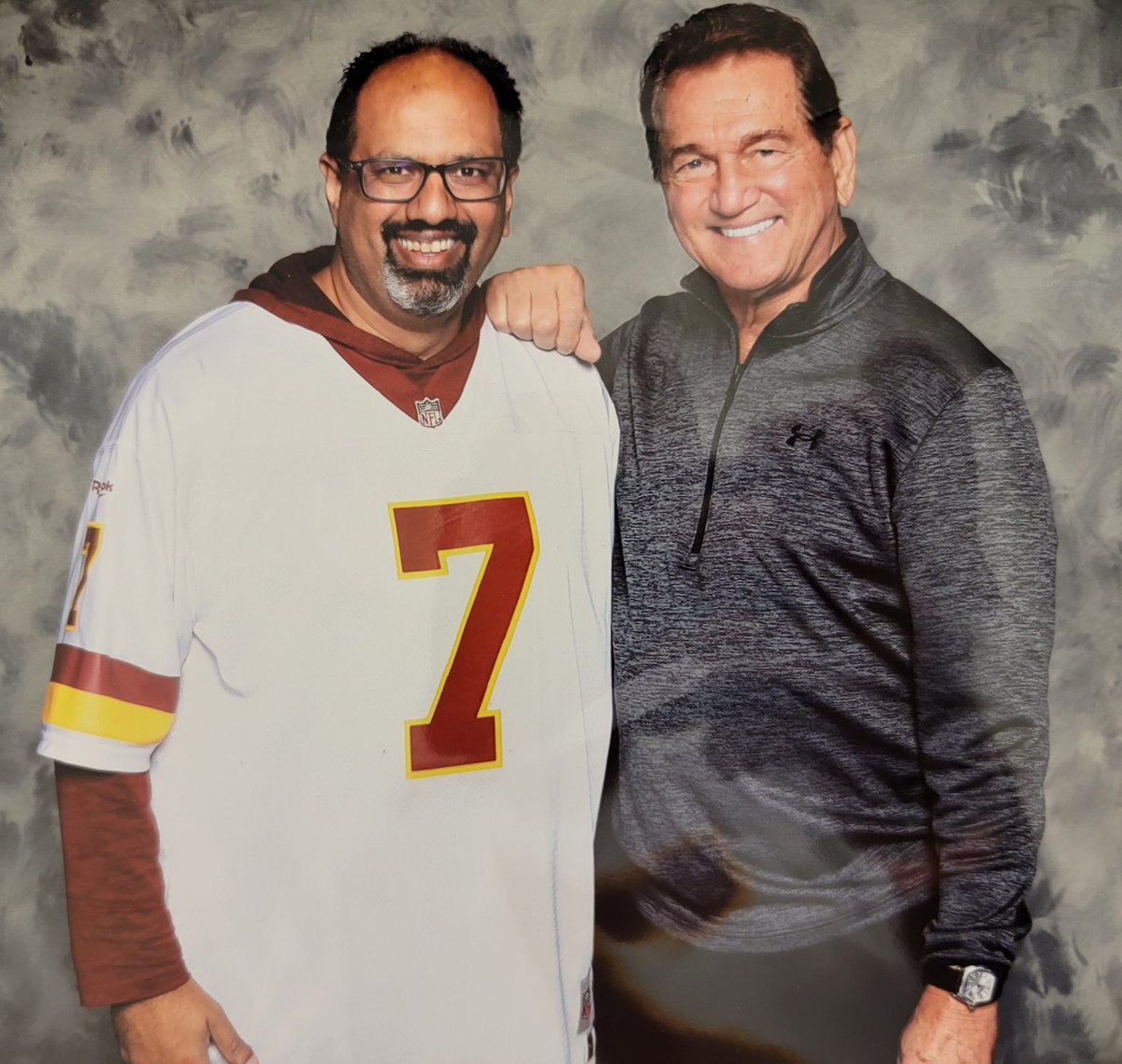khan_dc101's tweet photo. Big reason for my football fandom and super cool moment at @CSASHOWS. Would've regaled him about stories of my dad recording Skins games (on VHS) since 1981 or how the pass deflection in SB 17 is a life lesson for all. The handshake and this pic was cool enough! Thx @Theismann7 https://t.co/Rbr3RBChNT