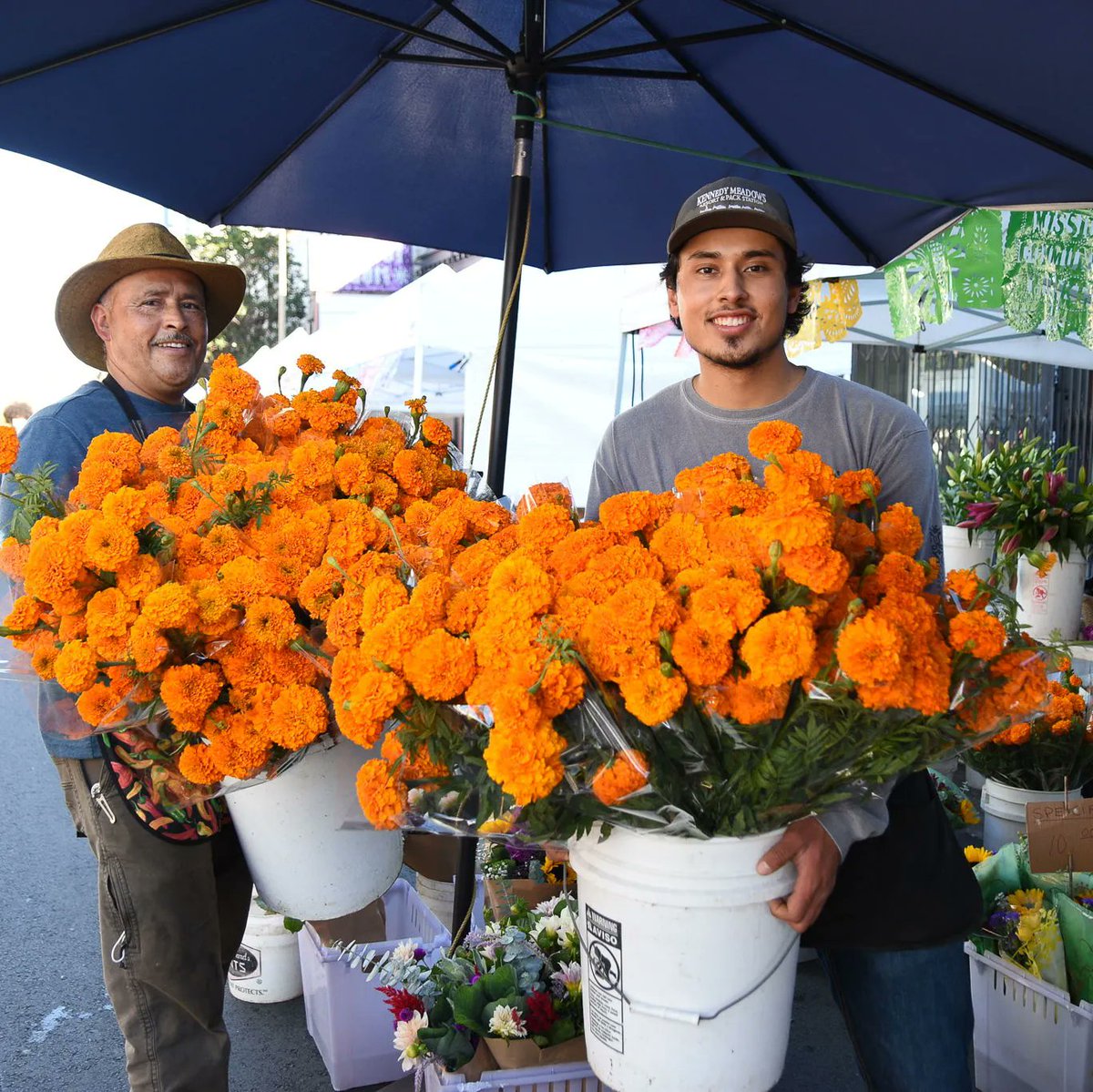 MissionMercado's tweet photo. This Thursday, October 27, join us at Mission Community Market to celebrate Día de los Muertos!🏵️💀 Contribute to our community ofrenda by bringing mementos to honor loved ones who have died, such as photos, favorite foods, or marigolds from Medrano's Flowers. See you Thursday! https://t.co/9fR8tC32Ba