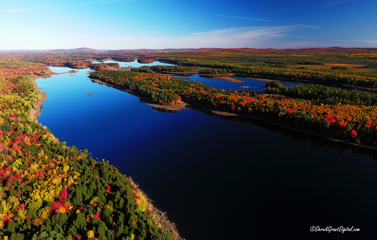 Drone view of the Headwaters of the St. Croix River over Spednic Lake, near Forest City, New Brunswick. Enough altitude to make out the undulating form of the Appalachians as they cross from Maine into NB on the distant horizon. #ExploreNB #DroneHour #ThePhotoHour #StormHour