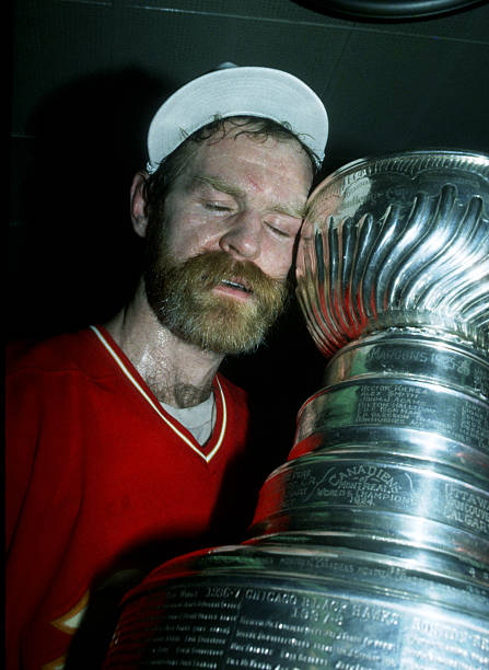 At long last. After 1111 regular season games and after his final game - 117th playoff game of his career - Lanny McDonald gets the holy grail. #Flames