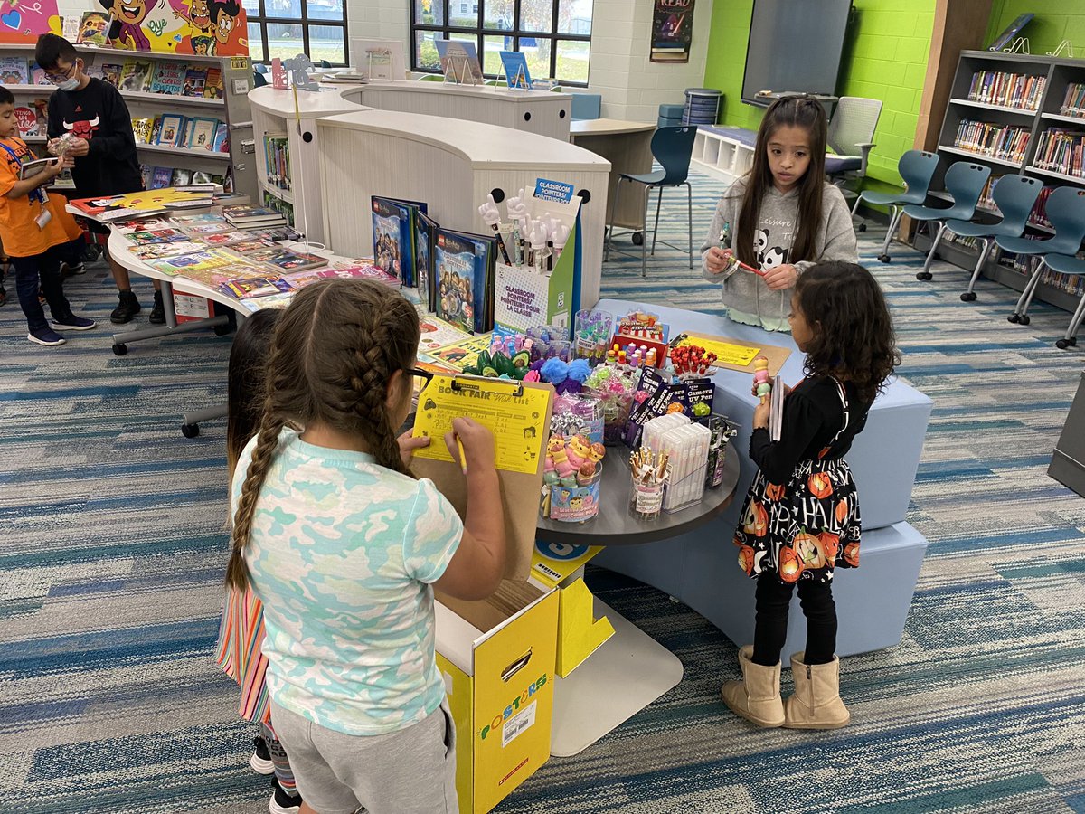 amberkim21's tweet photo. Love that my fifth graders will jump at any opportunity to help out!! Here they are helping kindergarteners buy books and write their wish lists from the @Scholastic book fair 😊 @ccsd21twain https://t.co/s3UhIwUEGf