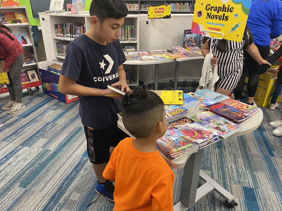 amberkim21's tweet photo. Love that my fifth graders will jump at any opportunity to help out!! Here they are helping kindergarteners buy books and write their wish lists from the @Scholastic book fair 😊 @ccsd21twain https://t.co/s3UhIwUEGf