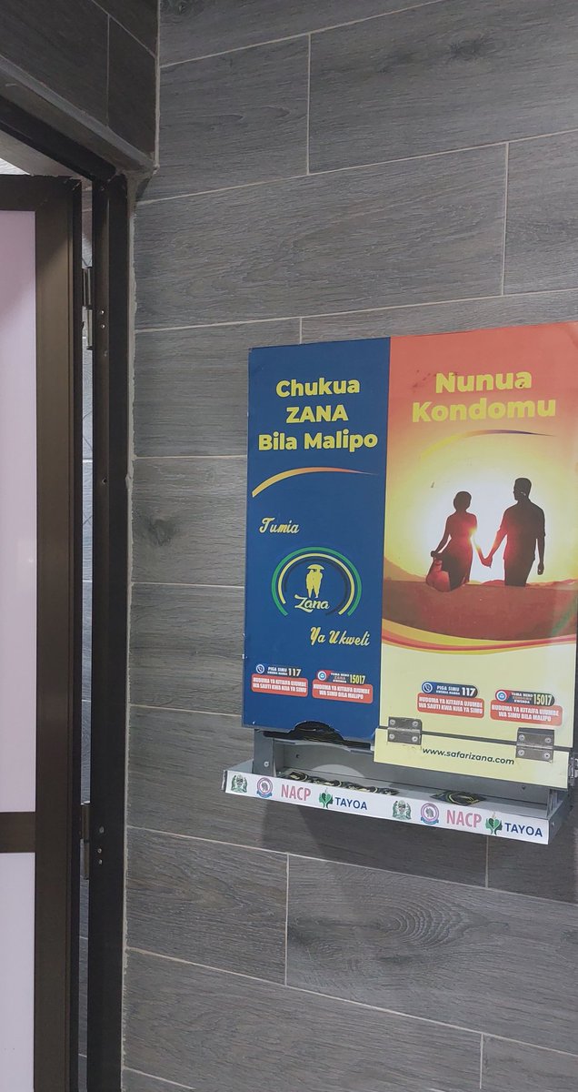 mariamngaeje's tweet photo. I found this condom dispenser at Dodoma airport lavatories and was pleased to see the outcome of the combined efforts towards addressing #HIV prevention. With joint  efforts,we can eliminate new HIV infections. #Agenda2030 #ENDAIDS. Hands of applause to @wizara_afyatz https://t.co/SqhDxpIDOR