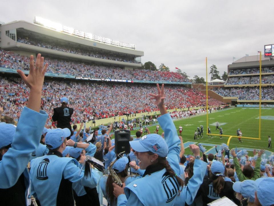 _hangryhannah's tweet photo. @carolina_pod @JonesAngell @jadamlucas Woke up to my husband @ZachEn8er saying "We made the pod!"  It's going to be a good day. Shout out 2 my days in the Marching Tar Heels and whoever who caught this moment during that fateful Gio Return game. I'm the one with the saxophone. https://t.co/NETjUB0x14