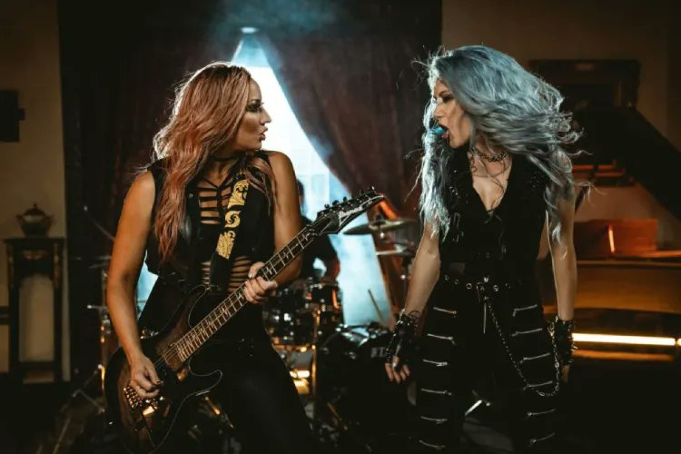 Nita Strauss and Arch Enemy's Alissa White-Gluz have teamed up for an incredible new track. Bang your head to 'The Wolf You Feed' bit.ly/3UbiQnx
