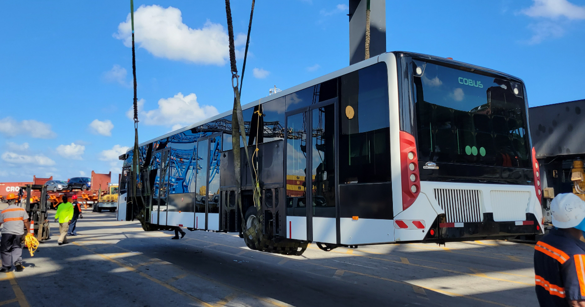CrowleyMaritime's tweet photo. We gave 2 airport buses a lift in Port Everglades to load them on our K-Storm vessel, bound for Rio Haina. Once they reach the airport in Santiago De Los Caballeros, they will be put to use shuttling passengers around the terminal. https://t.co/JsTB6WKCuQ