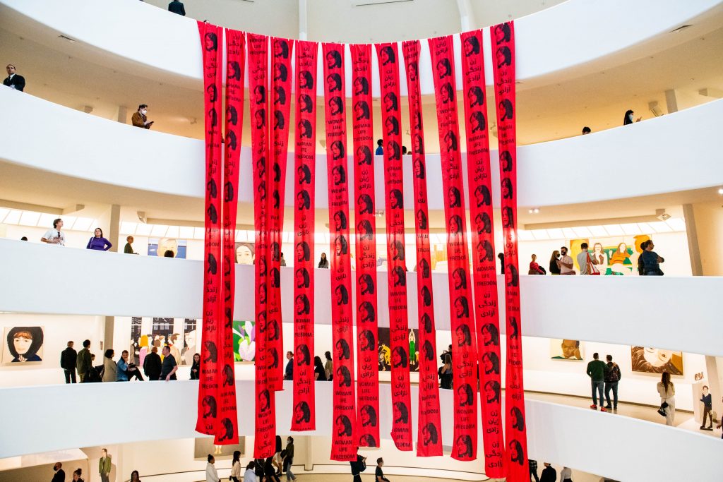 Artists unfurled red banners from the Guggenheim rotunda to support the Iran women's protest movement: bit.ly/3TTa3Gr