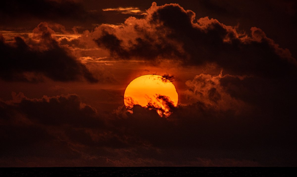 hthroop's tweet photo. Today's solar eclipse visible from #Colombo. Check out that 0.5% totality! Ingress just visible on RHS. Total visible duration before setting was 9 minutes in theory, but about 30 seconds considering the clouds.  #Eclipse2022  #SriLanka. https://t.co/Gig2v2xYeS