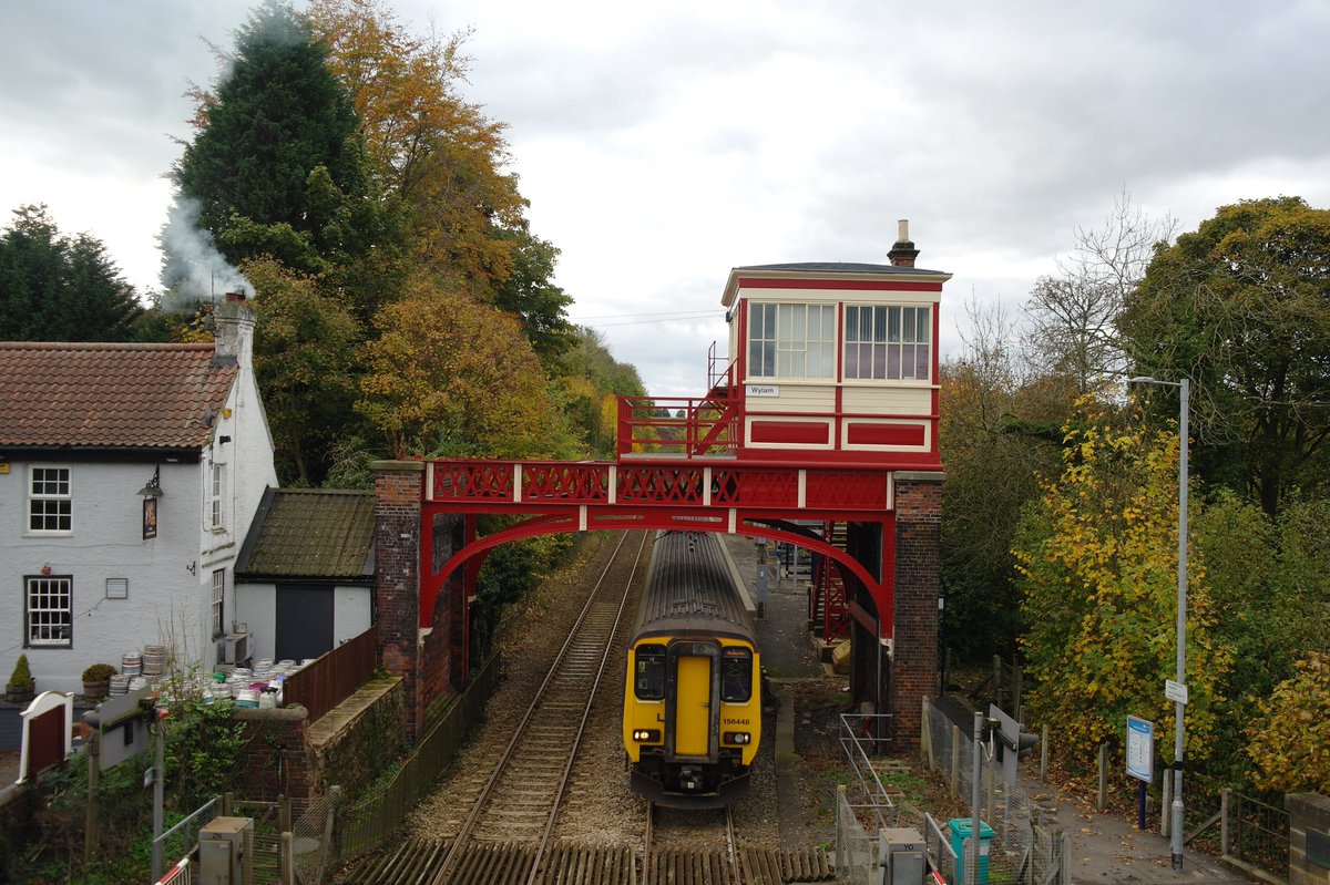 PickGS's tweet photo. A whisp of smoke from the chimney of @BoathouseWylam adds to the feel of Autumn as @northernassist Class 156, No. 156448 gets underway from Wylam, 2 minutes behind schedule, with 2N34 Hexham-Battersby, a destination it would reach 25 mins late. © Graeme Pickering @TVLRUG @TVCRP https://t.co/FBNNOUpSIR