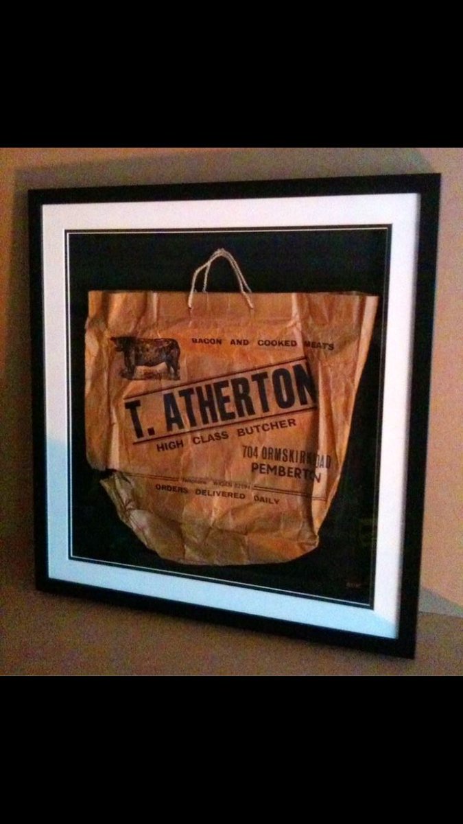 Old paper bag found in a drawer of their grandparents Family Butchers.Framed in a simple Black wooden moulding, float mounted onto black acid free card with UV glass.Stunning!